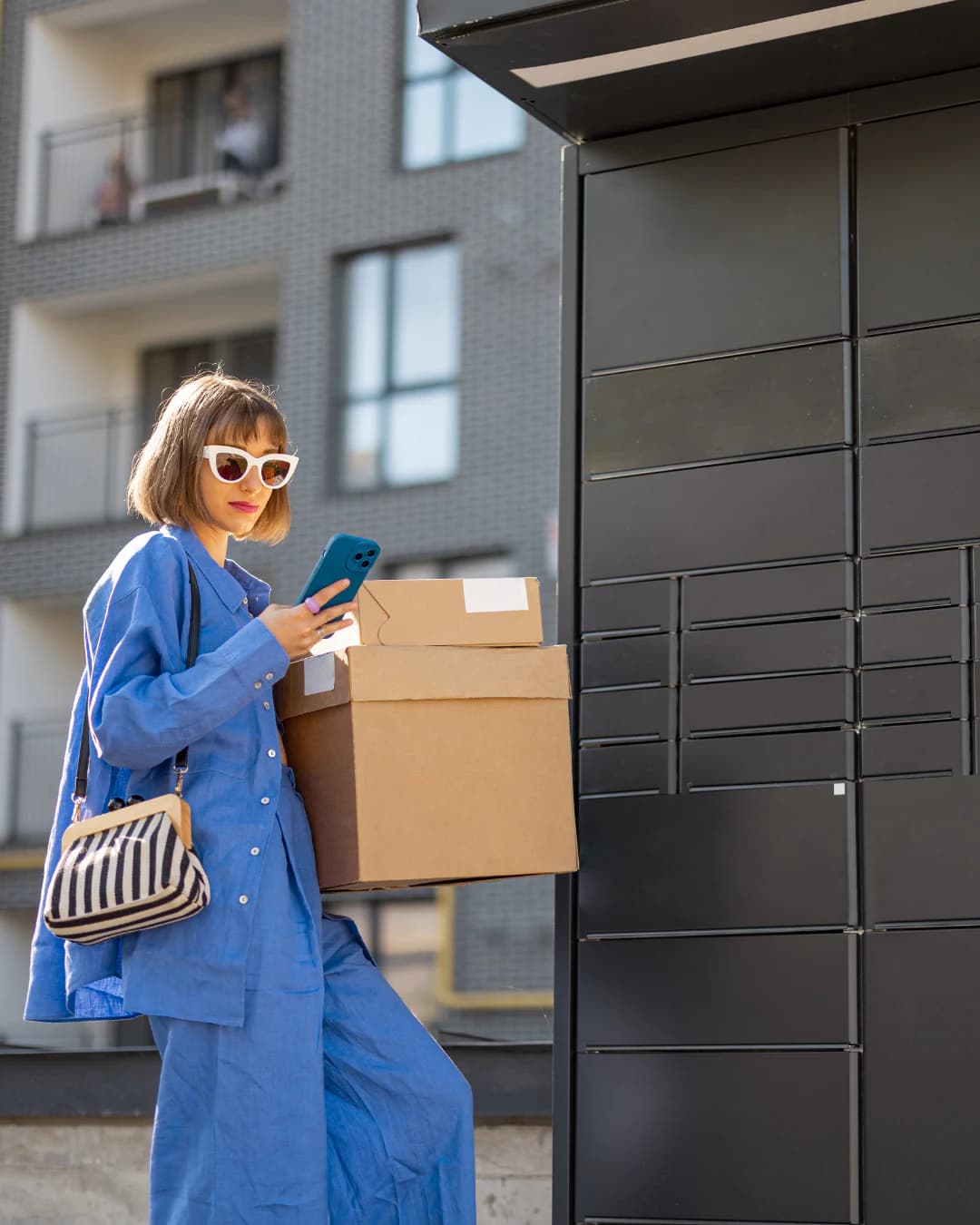 A customer collecting parcels from a parcel locker