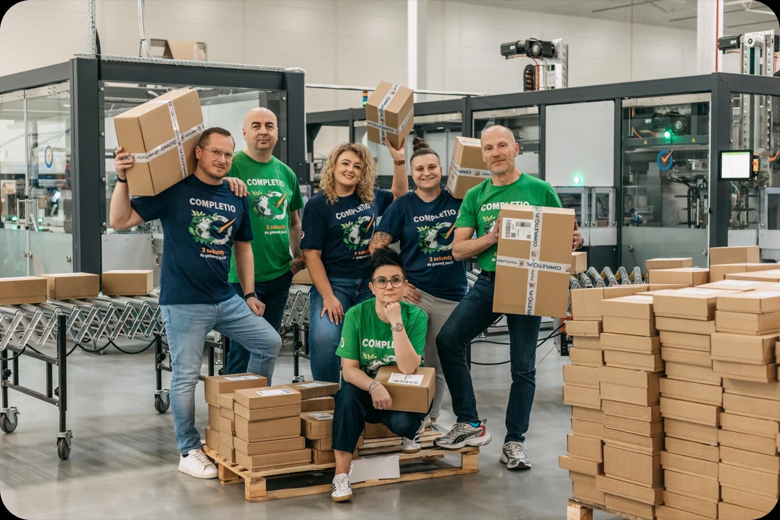 The Completio team with parcels ready for shipping in the warehouse