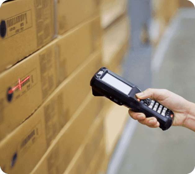 Scanning codes on cartons in the Completio warehouse